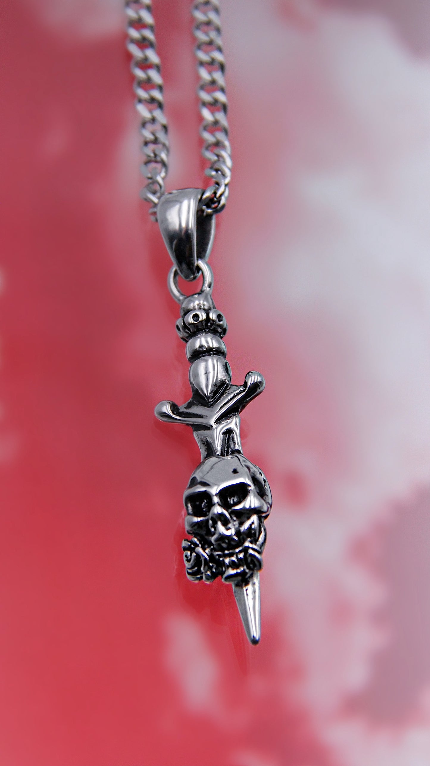 PIERCED SKULL NECKLACE