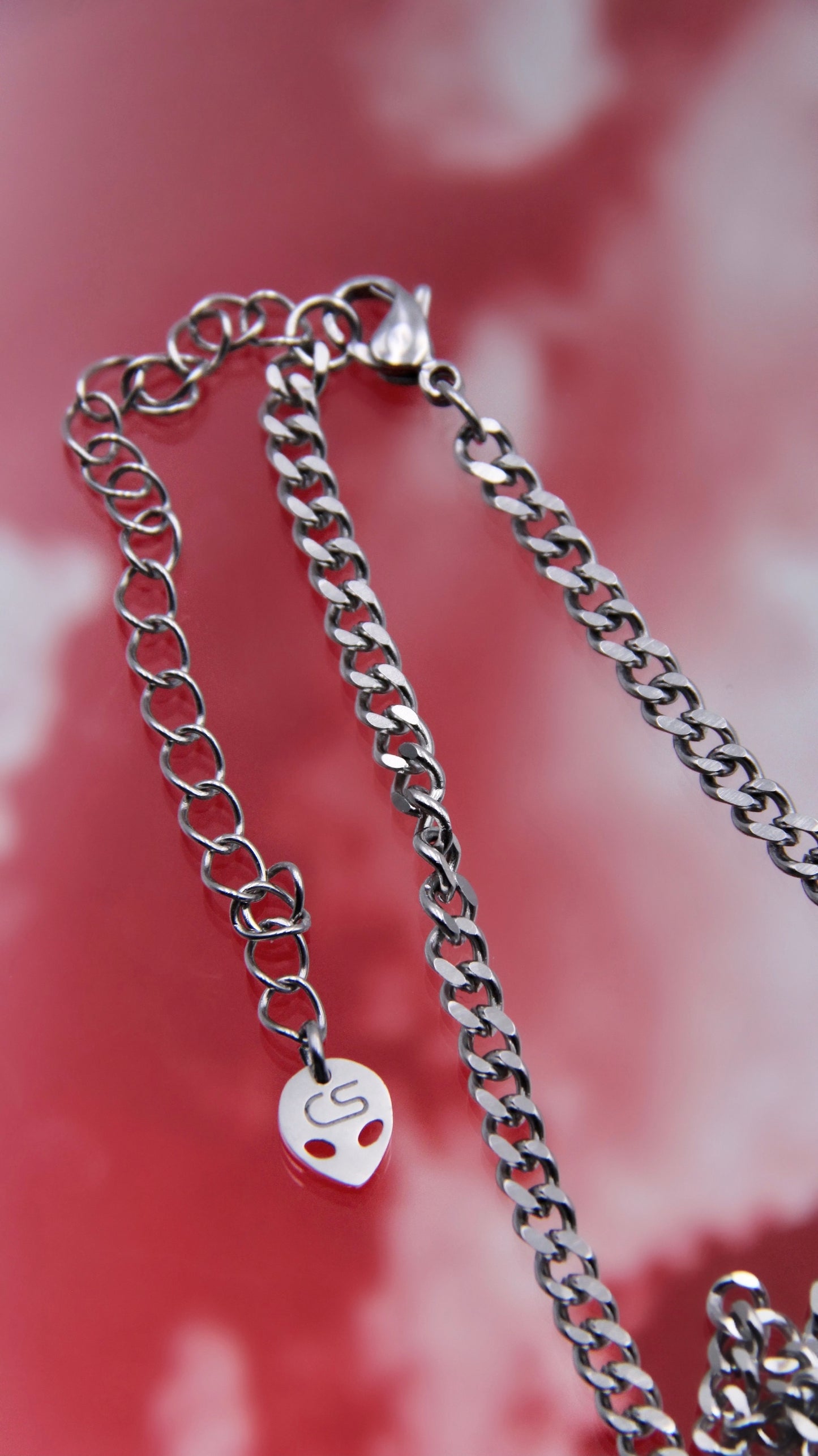 PIERCED SKULL NECKLACE
